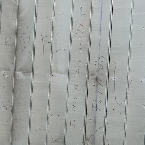 This says "1966, this house was 76 years old" we found this under the ceiling tiles we took down in the room